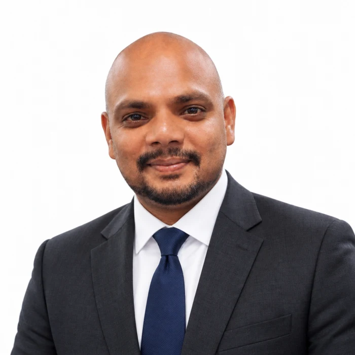 Hansel Martis, Founder of 3rd Eye Studios, wearing a suit and tie